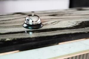 Hotel reception counter desk with service bell. photo