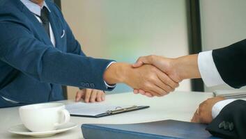 Businessman shaking hands successful. mans handshake. Business partnership meeting concept. photo
