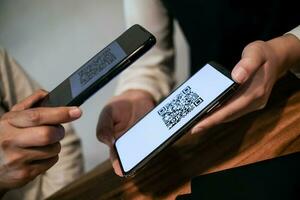 Qr code payment. Woman scanning QR code online shopping cashless technology concept. photo