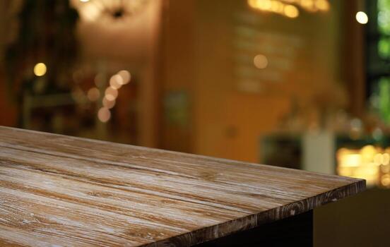 Empty wooden table in front of abstract blurred background of coffee shop . can be used for display or montage your products.Mock up for display of product photo