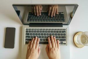 woman using computer laptop for work online at living room. photo