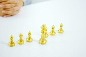 Human resources concept career management with clasped hands planning strategy with chess figures. photo