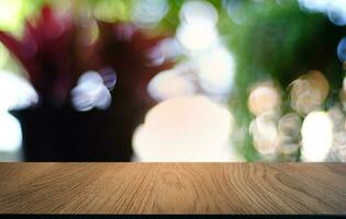 Empty dark wooden table in front of abstract blurred bokeh background of restaurant . can be used for display or montage your products.Mock up for space. photo