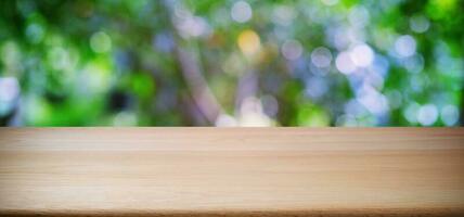 Empty dark wooden table in front of abstract blurred bokeh background of restaurant . can be used for display or montage your products.Mock up for space. photo