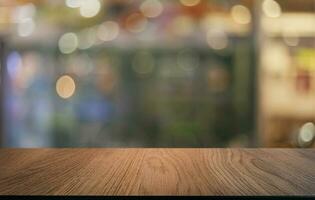 Wood Table Top in Blur Background room interior with empty copy space. photo