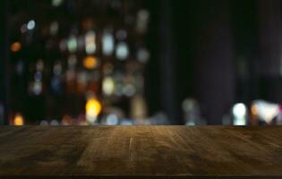 Empty wooden table in front of abstract blurred background of coffee shop . can be used for display or montage your products.Mock up for display of product photo