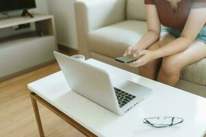 Woman texting checking social media holding smartphone at home Conversation with boyfriend or friend photo