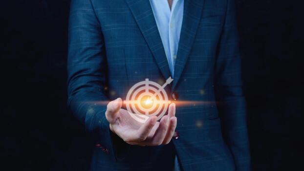Targeting concept with businessman hand holding digital image of dartboard,Businessman holding virtual dartboard and arrow with copy space for setup business objective target concept. photo