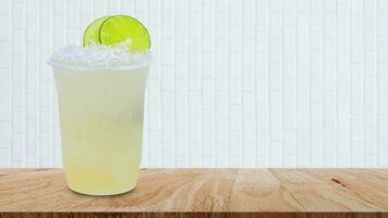 Cool freshly made lemonade in a plastic cups with crushed ice and lemon slices on wooden table with white background photo