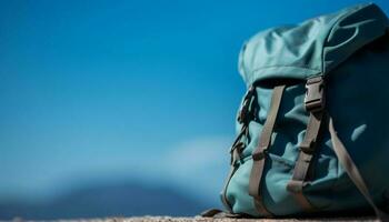 Hiking backpack on mountain peak, a perfect adventure for exploration generated by AI photo
