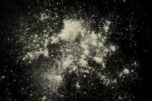 abstract white powder texture in black background photo