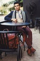 Handsome Indian man wearing vintage business clothes photo