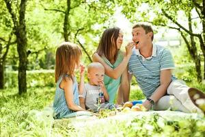 Beautiful family in the park photo