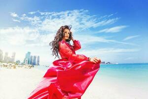 Woman on red dress outdoors photo