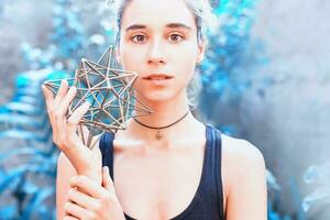 Woman meditating on sacred geometry photo