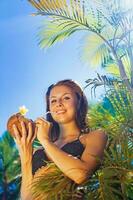 woman drinking coconut cocktail photo