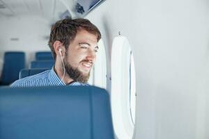 Man enjoying his journey by airplane photo