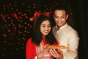 Indian couple with candle photo