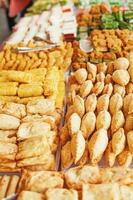 Various snacks on sale in Ramadan street market in Jakarta photo