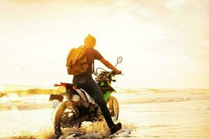 Man traveling on the motorcycle photo