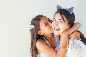 two asian girls dressed wearing cat ears photo