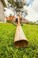 Man with a bamboo instrument photo