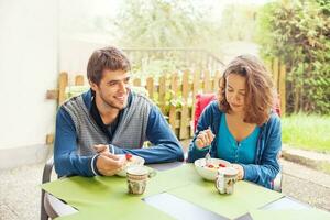 family eating outdoors photo