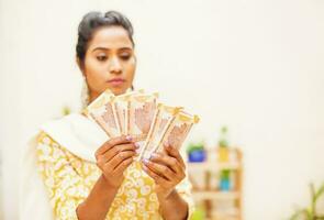 Indian woman with cash photo