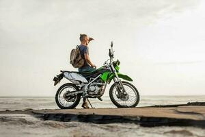 Man traveling on the motorcycle photo