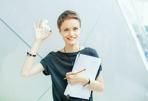 Creative idea concept. Woman holding a lamp photo