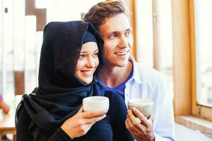 muslim caucasian family drinking tea photo