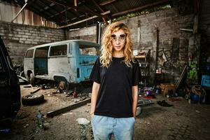 urban style girl in a grunge garage photo