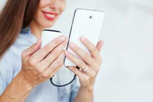 businesswoman using portable power bank to charge her phone photo