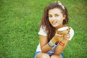 woman eating an exotic fruit photo