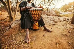 faceless photo of an african drummer playing
