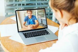 video call. woman and man talking on web camera in office photo