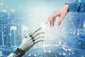 Artificial intelligence and machine learning concept. Hands of robot and human meet over futuristic city backgroud photo