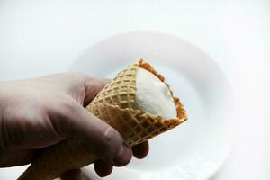 Ice cream cone on a white plate. Delicious ice cream. photo