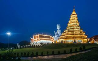 The Chinese pagoda style of Wat Huay Pla Kang in Chiang Rai province of Thailand at night. photo