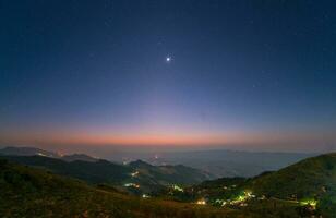 Night landscape from the high mountains in the countryside of Chiang Rai province of Thailand. photo