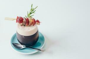 The passion fruit Mocktail serving on white table with isolated white background. photo