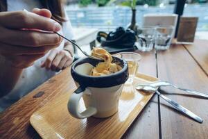 A cup of Affogato on the wooden table in the coffee shop. photo