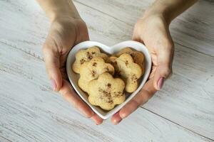 Festive ginger cookies with cinnamon in the shape of hearts photo