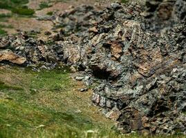 Spirits of the mountains. Natural scary stone Ram's Head profile. Stone idols, mystical spirits of the mountains locked in stone. Mystical Altai Mountains. Demon in the stone. photo