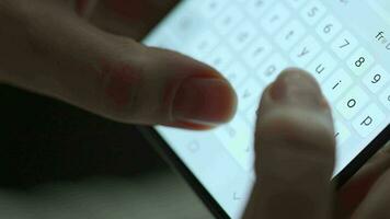 Female hands typing text on smartphone close-up video