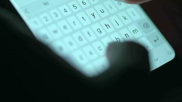 Female hands typing text on smartphone close-up. Using smartphone close up in the evening video