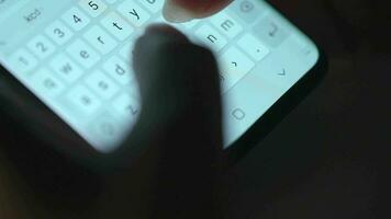 Female hands typing text on smartphone close-up. Using smartphone close up in the evening video