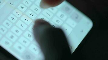 Female hands typing text on smartphone close-up. Using smartphone close up in the evening video