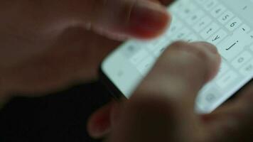 Female hands typing text on smartphone close-up video