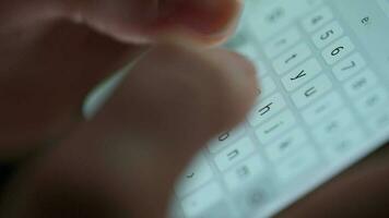 Female hands typing text on smartphone close-up video